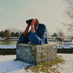 "Man with binoculars. Sculpture by Denis Perret-Gentil.